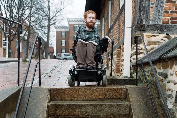 A Riding On Friends’ Back, Wheelchair-Bound Man Sets Out On A Backpacking Trip To Europe