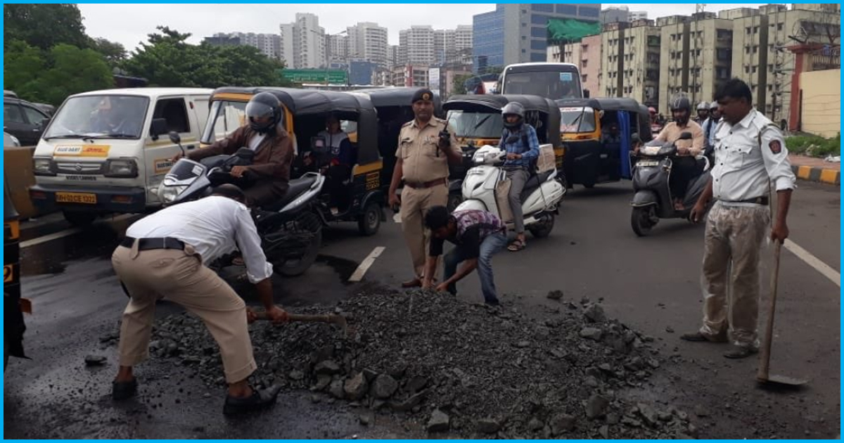 Amidst Heavy Rain, Mumbai Traffic Police Fill Potholes On Highway