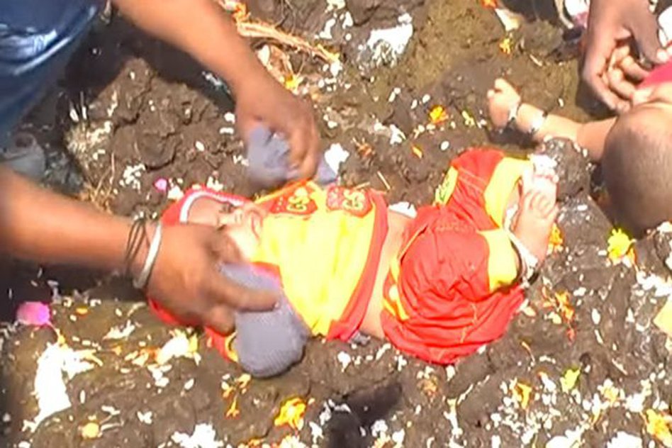 Video: Parents Dip Kids In Holy Cow Dung During Ritual