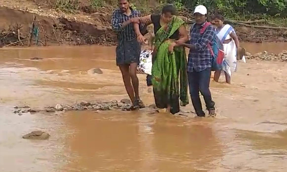 Telangana: Pregnant Woman Forced To Cross Rivulet On Foot Due To Damaged Road, Absence Of Bridge