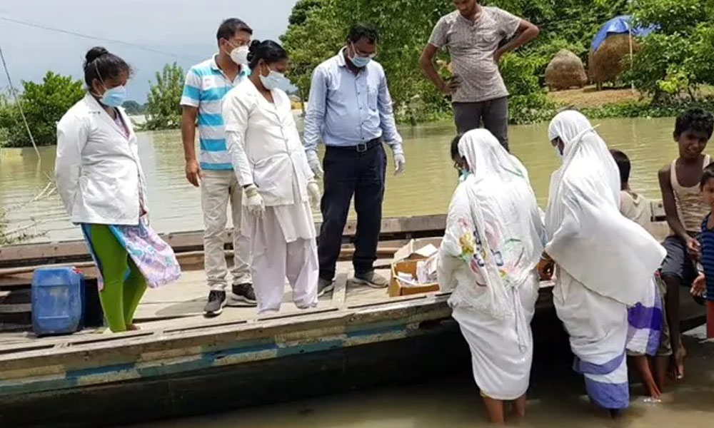 Assam Floods: Health Workers Borrow Boats To Provide Aid To Flood-Victims Amid COVID-19 Crisis