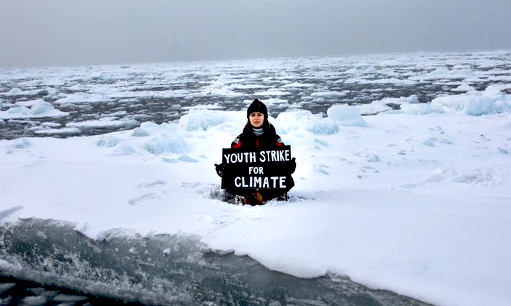 18-Yr-Old British Climate Activist Stages Protest From Arctic Ice Cap