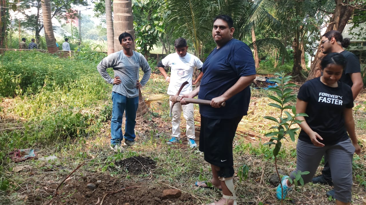 Doing plantation activity with some volunteers