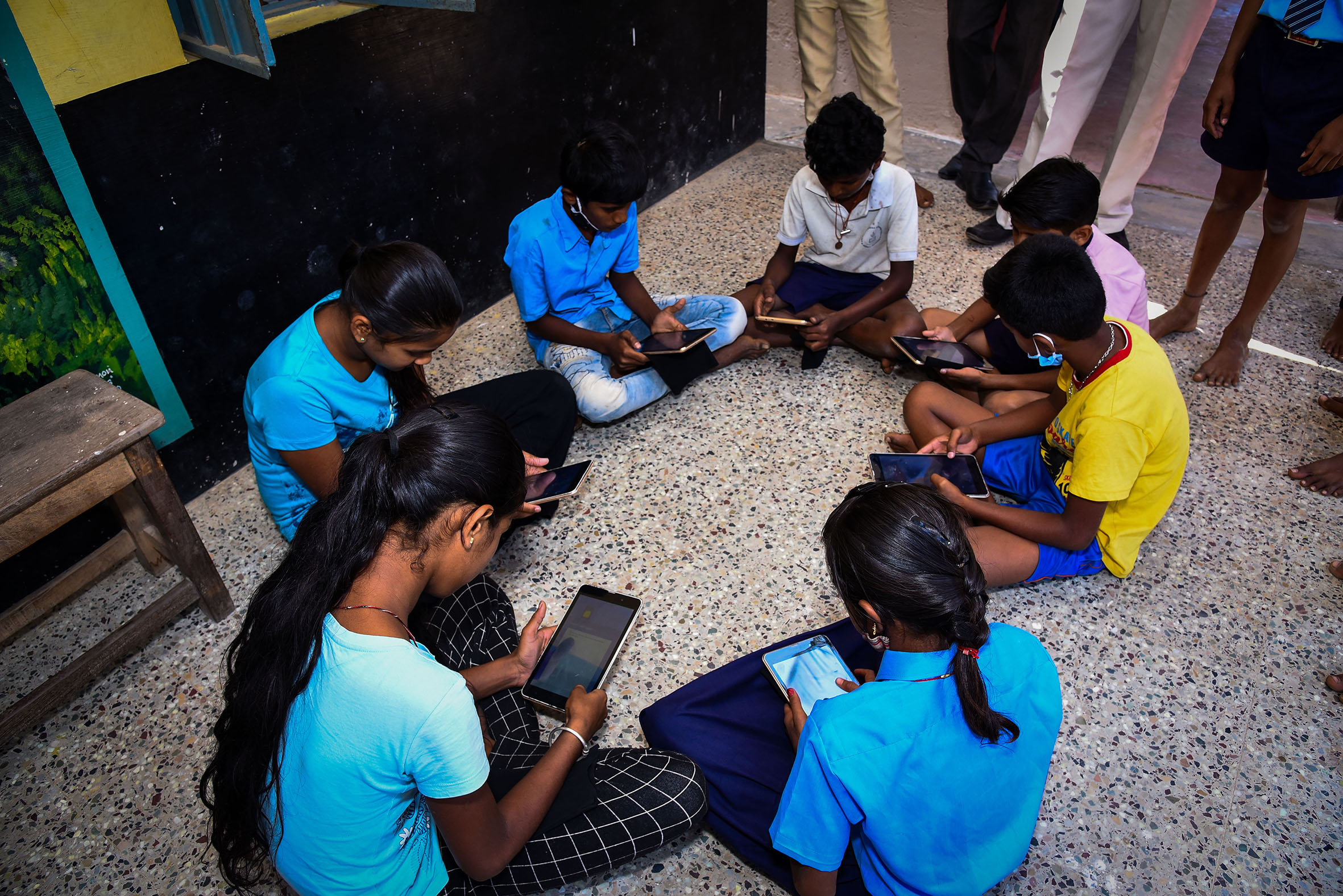 Children using digital devices for education