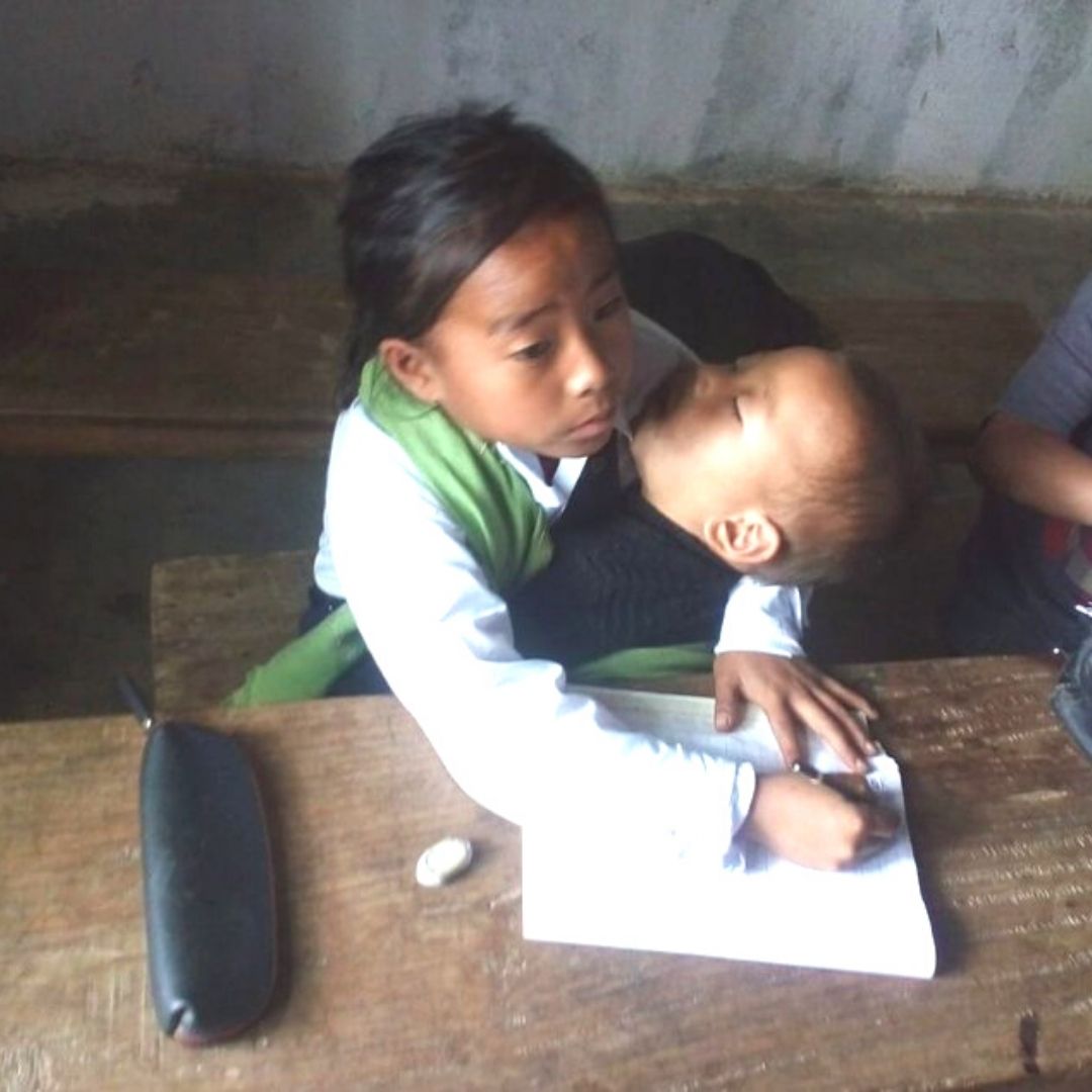 10-Yr-Old Manipur Girl Attends Class While Babysitting Her Sister, Picture Goes Viral