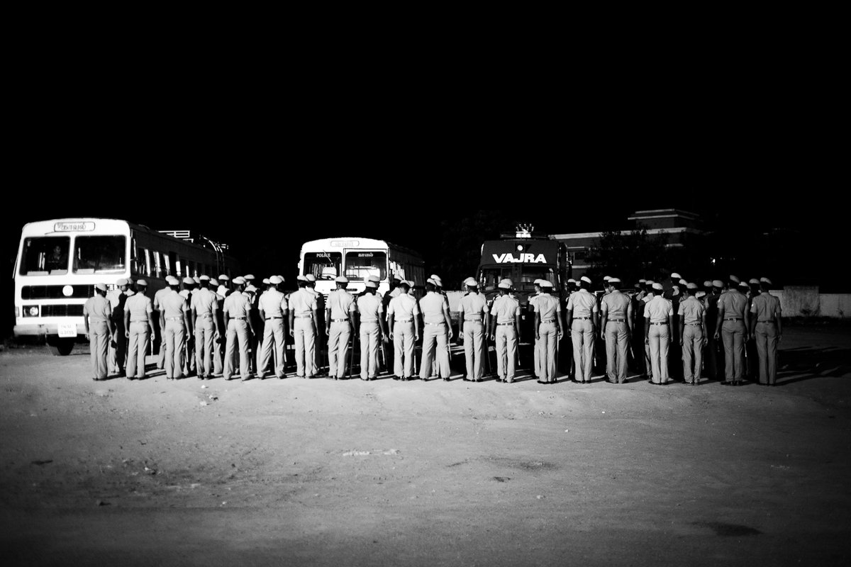 Police forces assemble in front of the KNPP before going on rounds in Koodankulam village after the imposition of a curfew. (May 10, 2012)